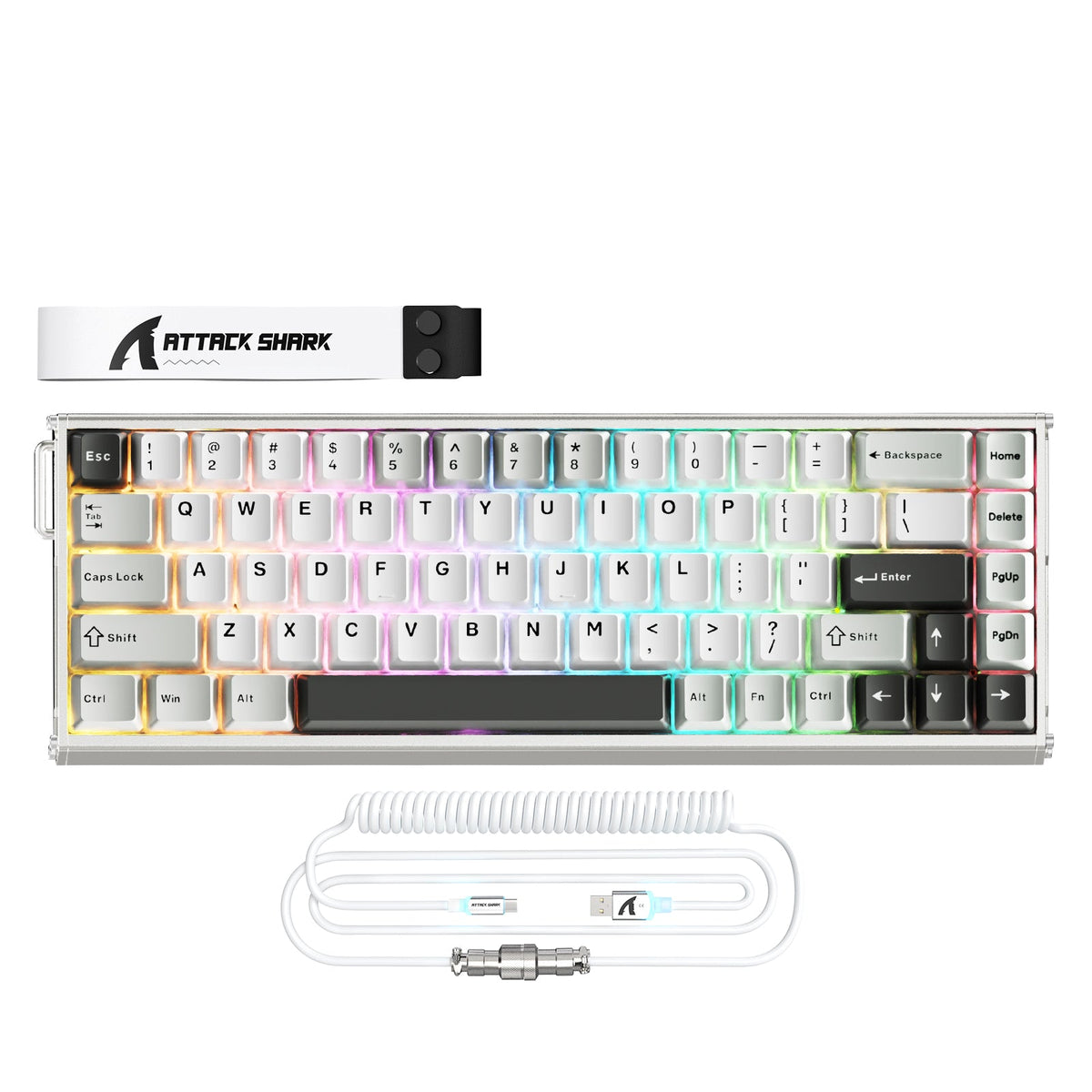 White compact keyboard with a coiled cable arranged on a clean desk